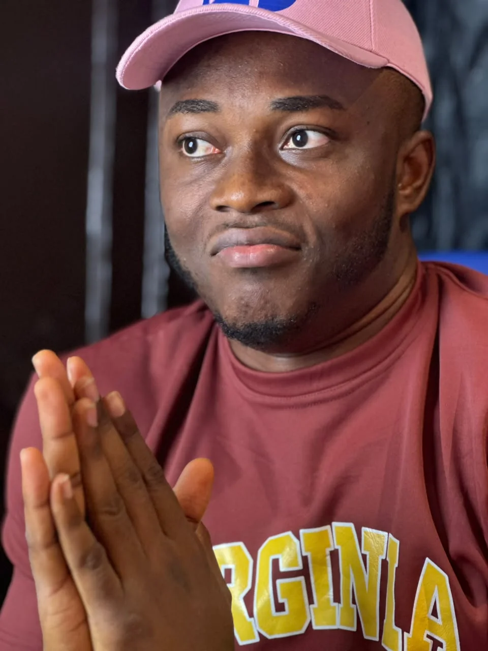 Godwin in a pink cap